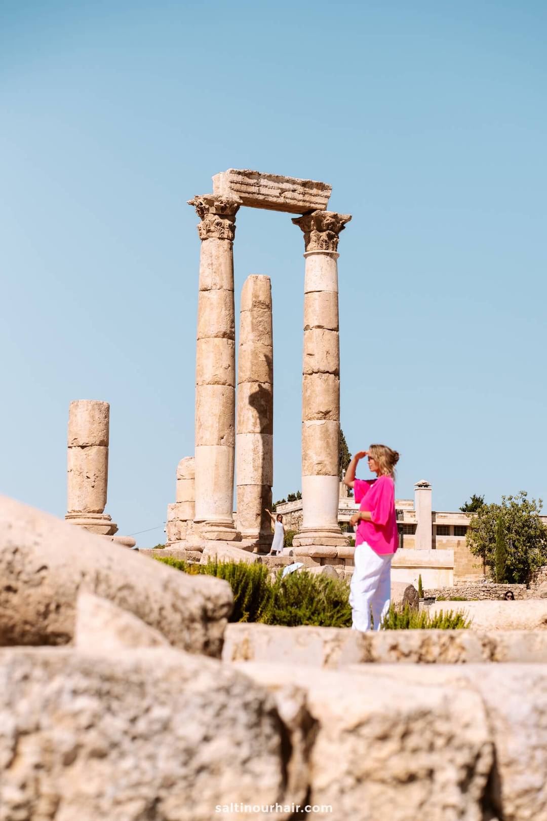 woman wandering at citadel amman jordan