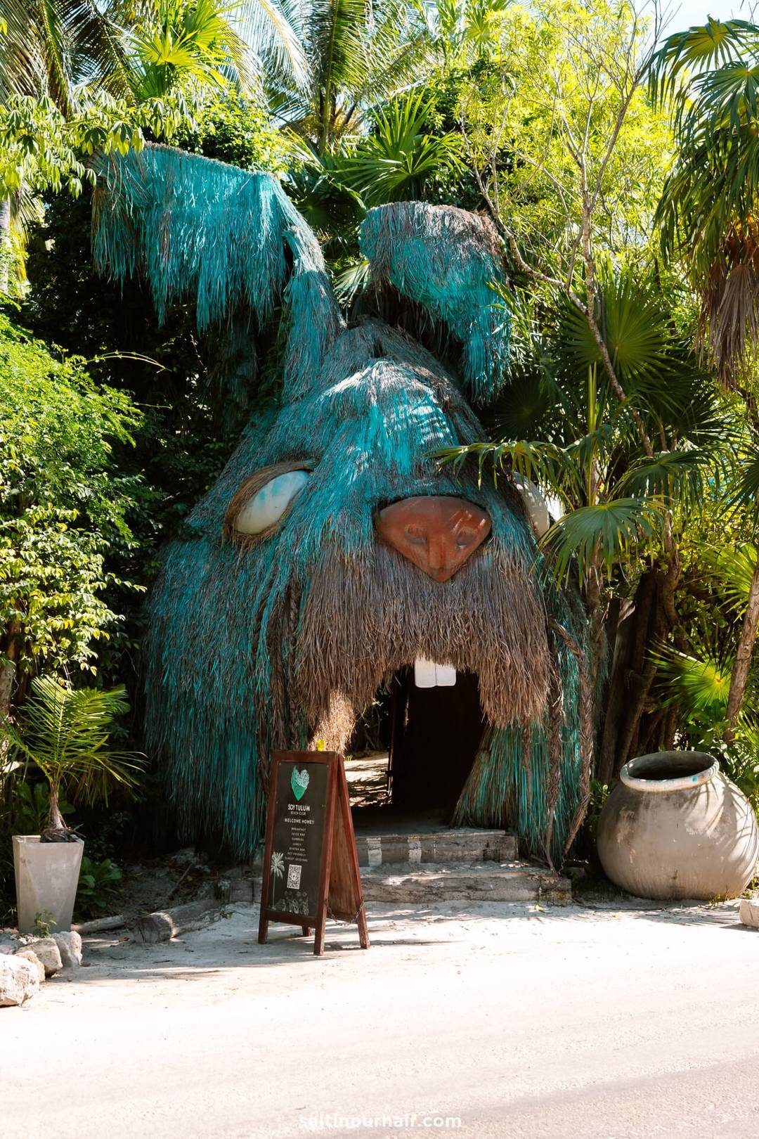 things to do in Tulum beach bar entrance sculpture