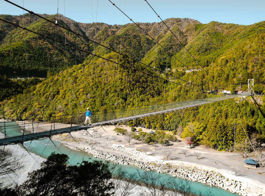 3 weeks in japan suspension bridge with clear blue water at country side