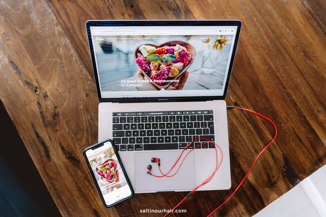 how to start a blog laptop and phone photographed from above